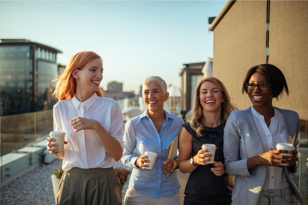 Happy business women having coffee