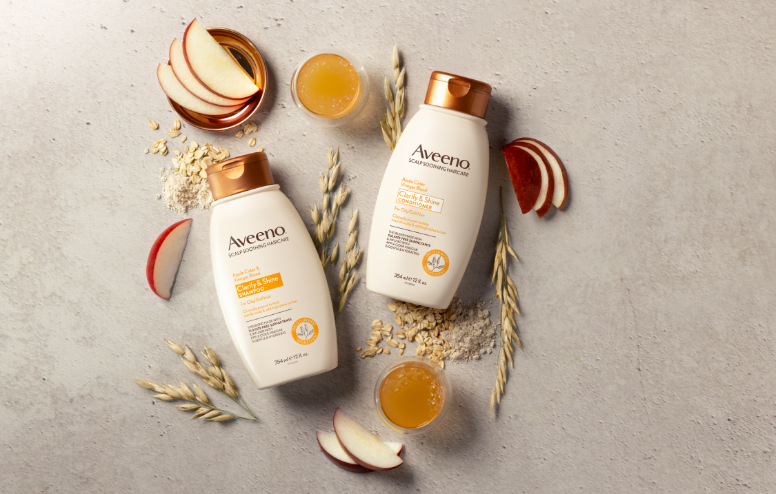 Aveeno® Clarity & Shine Apple Cider Vinegar Blend haircare set to clarify and add shine to dull hair