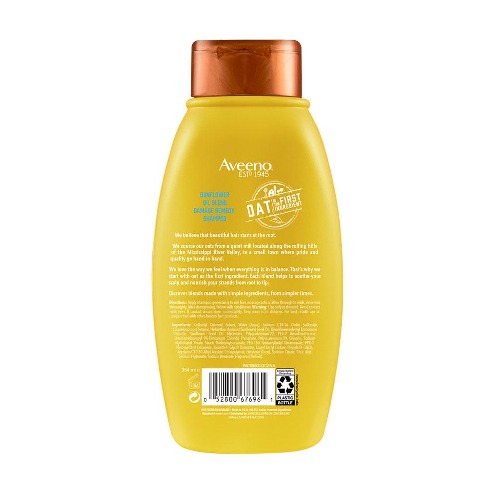 Parte posterior de la botella de Aveeno® Sunflower Blend Shampoo